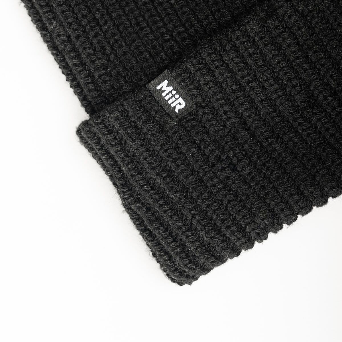 recycled-poly-rib-beanie-k7 WebPDP-RecycledPolyRibBeanie_Studio_TagDetail_Black__BNE002002OS.jpg